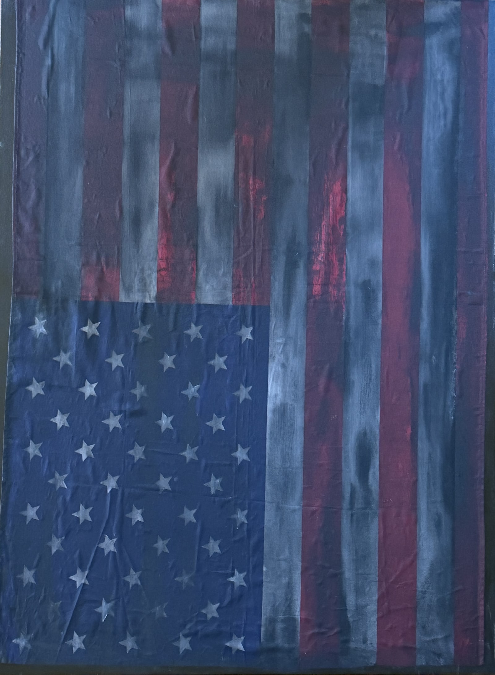 Painting: an American flag, hand-painted over and hung upside down as a distress signal, drained to mourning colors.
